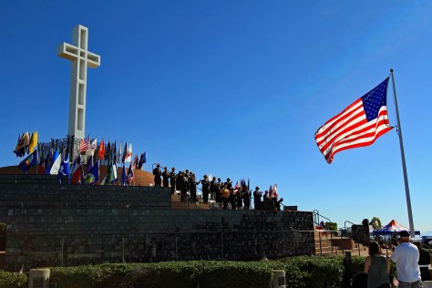 People gathered on mt soledad, american flag to the right